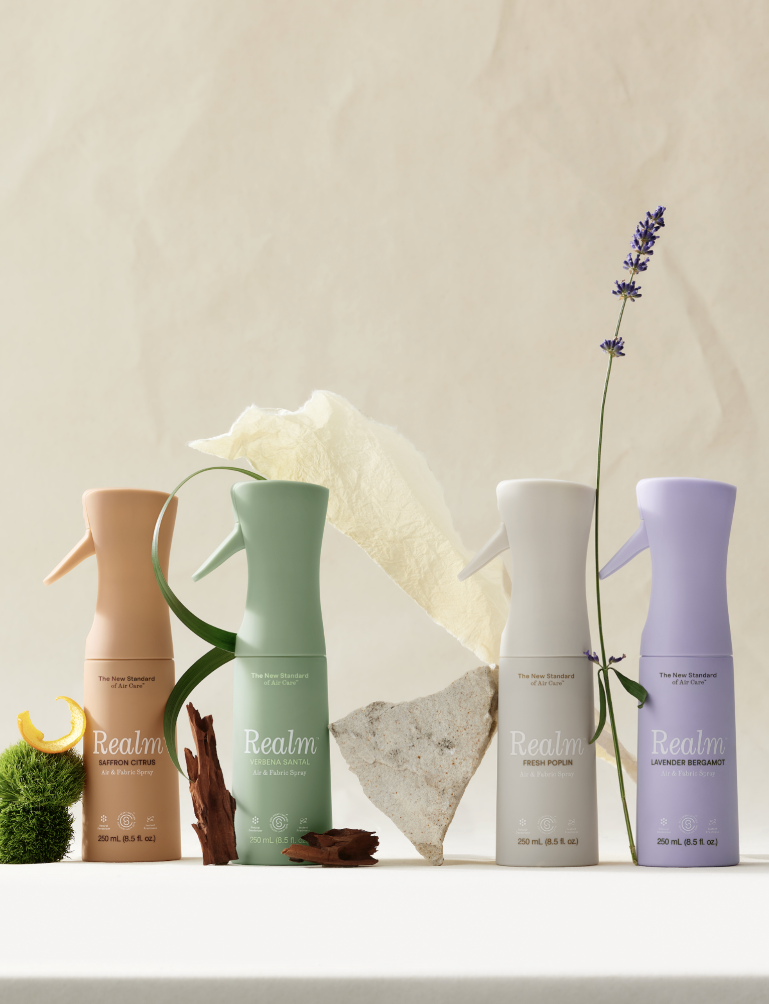 Four Realm air and fabric spray bottles in pastel colours
